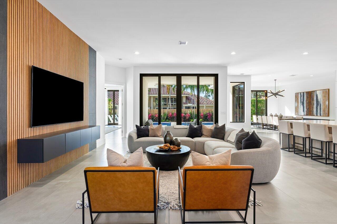 636 Eddy Street Boca Raton, FL 33487 - Photo 11 of 44 a living room with fireplace furniture and a flat screen tv