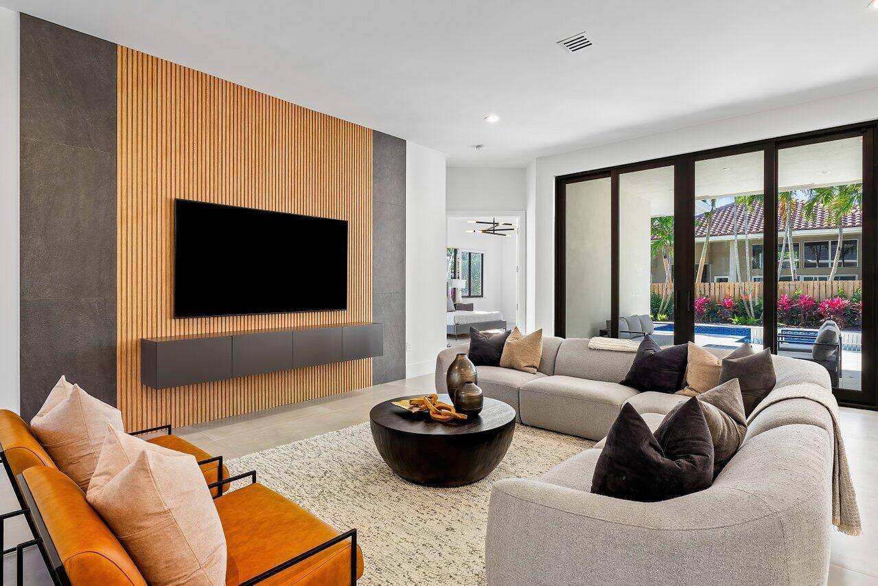 636 Eddy Street Boca Raton, FL 33487 - Photo 12 of 44 a living room with furniture and a flat screen tv