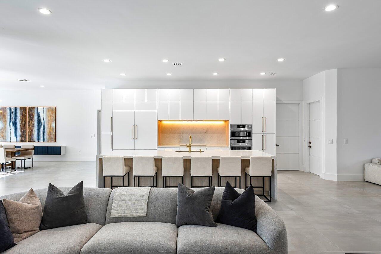 636 Eddy Street Boca Raton, FL 33487 - Photo 14 of 44 a living room with furniture kitchen view and a wooden floor