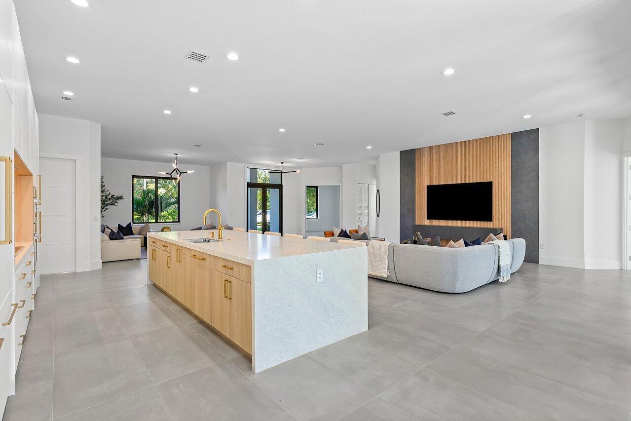 636 Eddy Street Boca Raton, FL 33487 - Photo 16 of 44 a living room with furniture and a flat screen tv