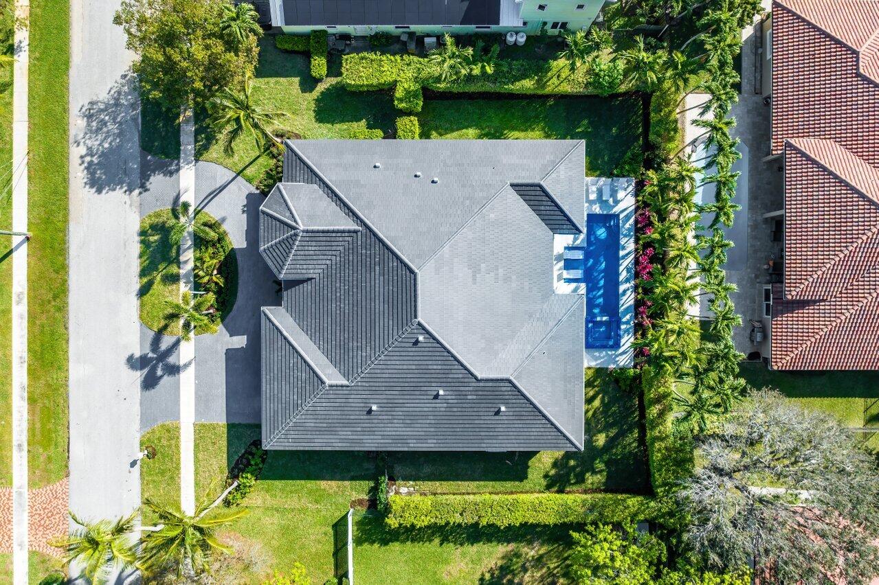 636 Eddy Street Boca Raton, FL 33487 - Photo 2 of 44 an aerial view of a house with a yard