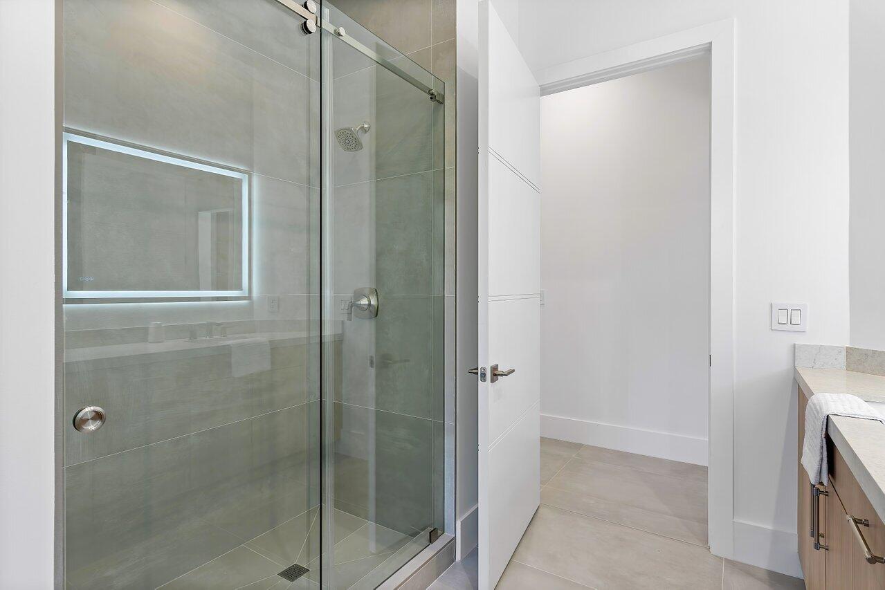 636 Eddy Street Boca Raton, FL 33487 - Photo 34 of 44 a bathroom with a shower and a sink
