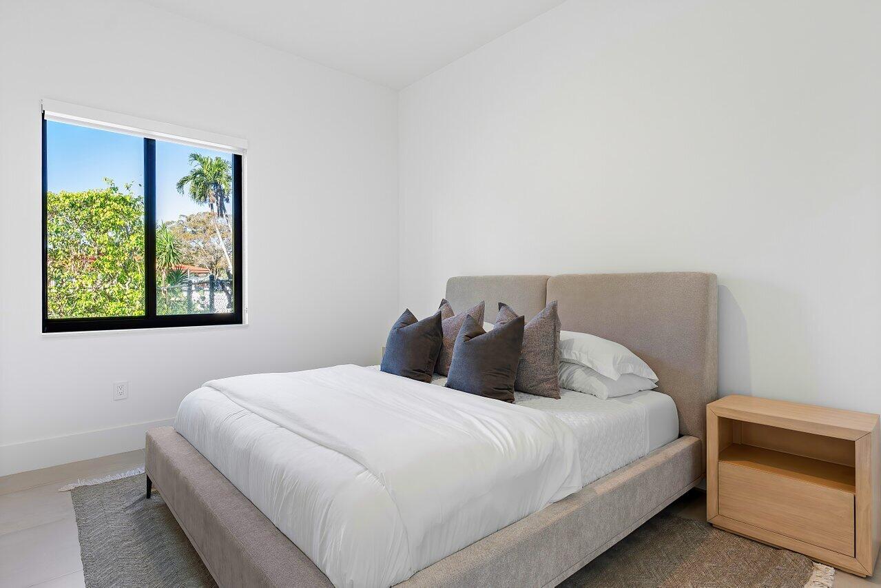 636 Eddy Street Boca Raton, FL 33487 - Photo 37 of 44 a bedroom with a bed and a window