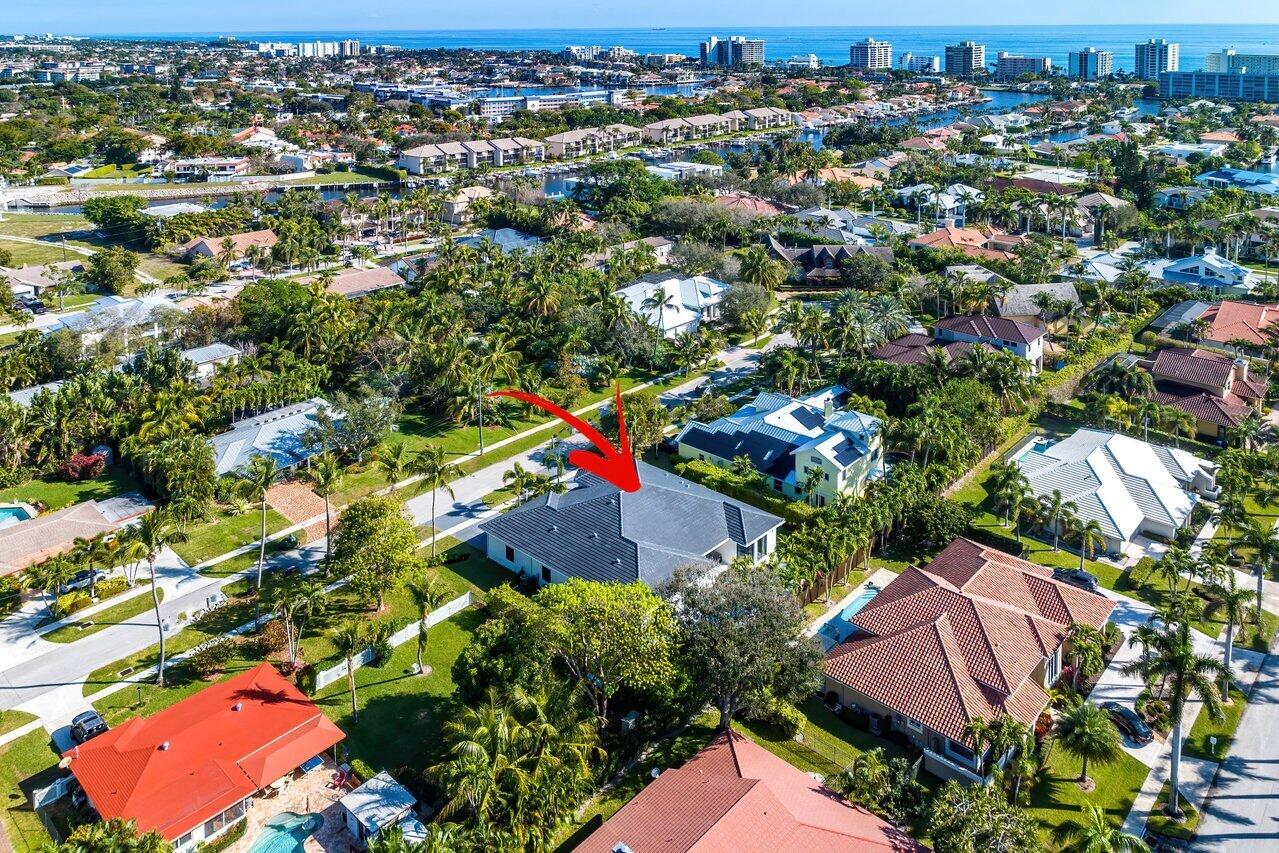 636 Eddy Street Boca Raton, FL 33487 - Photo 43 of 44 an aerial view of residential houses with outdoor space and trees