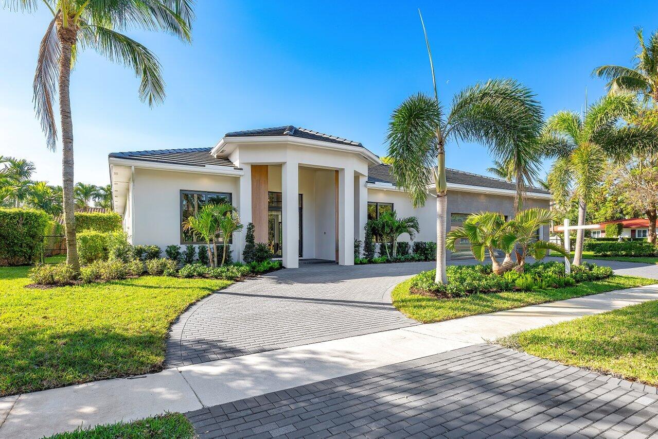 636 Eddy Street Boca Raton, FL 33487 - Photo 5 of 44 a front view of house with yard and green space