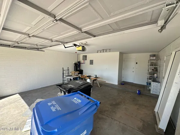 a room with wooden floor and white walls