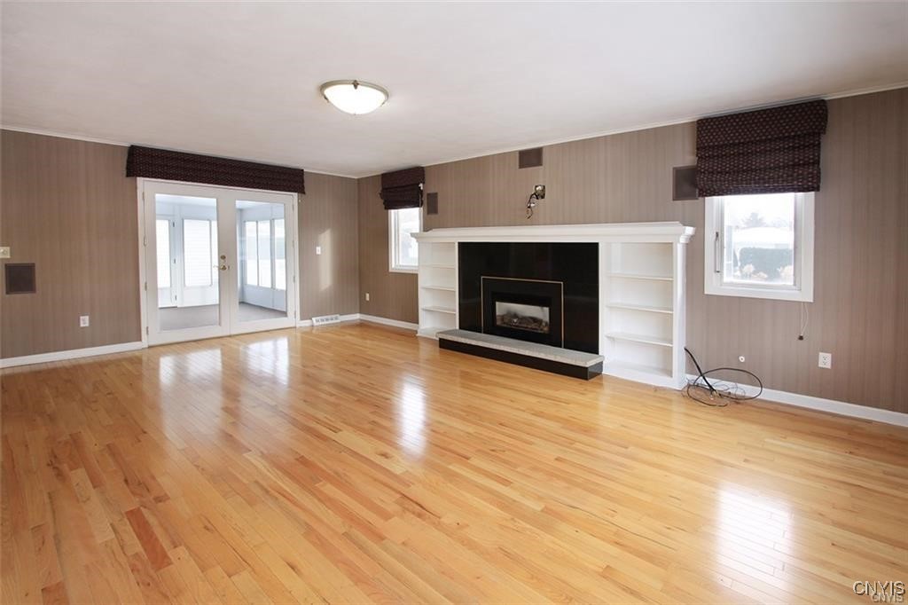 101 Britain Road Manlius, NY 13066 - Photo 13 of 31 Familyroom has a gas fireplace, Roman shades,