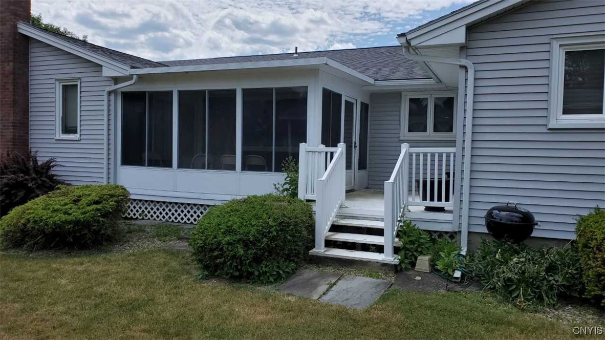 101 Britain Road Manlius, NY 13066 - Photo 2 of 31 Enclosed porch with deck off to your backyard.