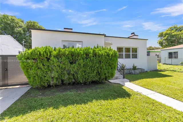a view of a back yard with a garden