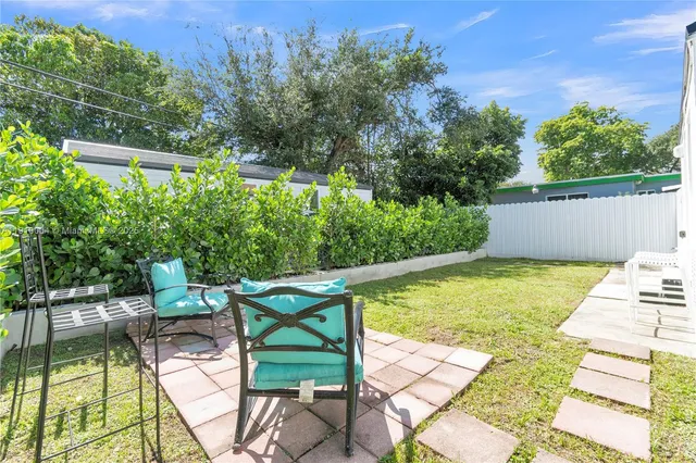 a view of swimming pool with chairs