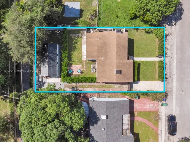 a bird view of house with outdoor space and seating