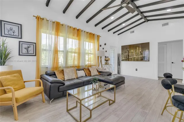 a living room with furniture and a window