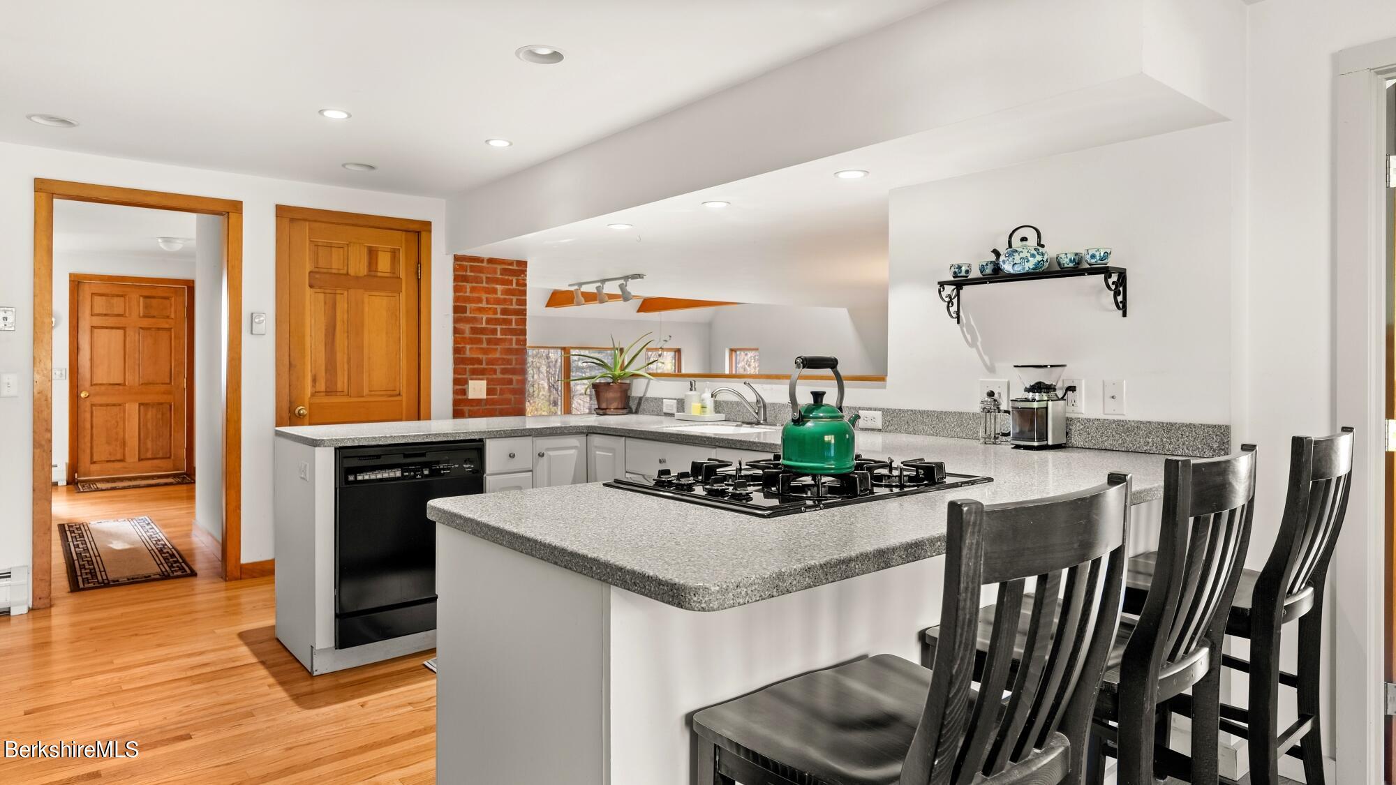 16 Interlaken Road Stockbridge, MA 01266 - Photo 13 of 42 a kitchen with a table chairs stove and refrigerator