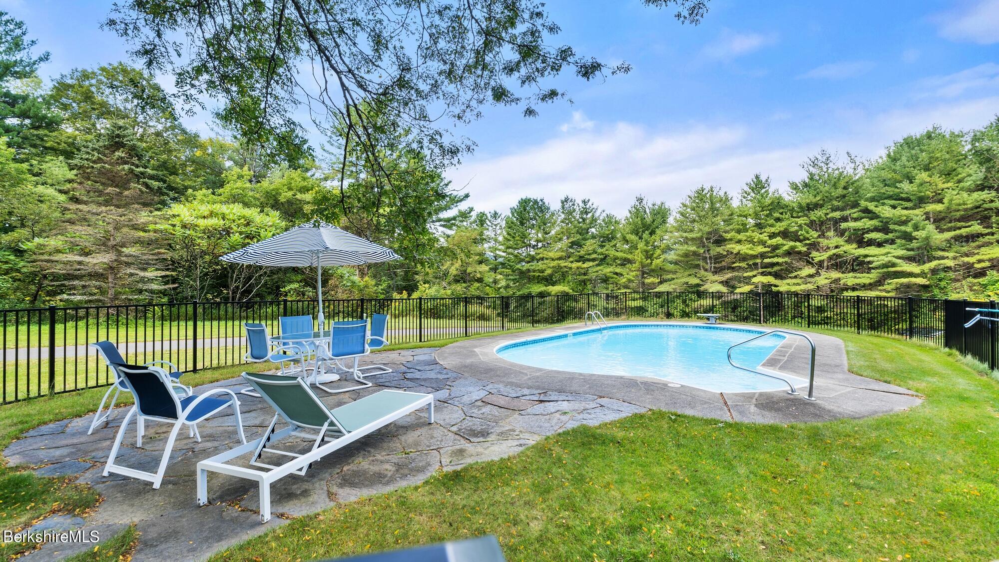 16 Interlaken Road Stockbridge, MA 01266 - Photo 4 of 42 a view of a swimming pool with a patio