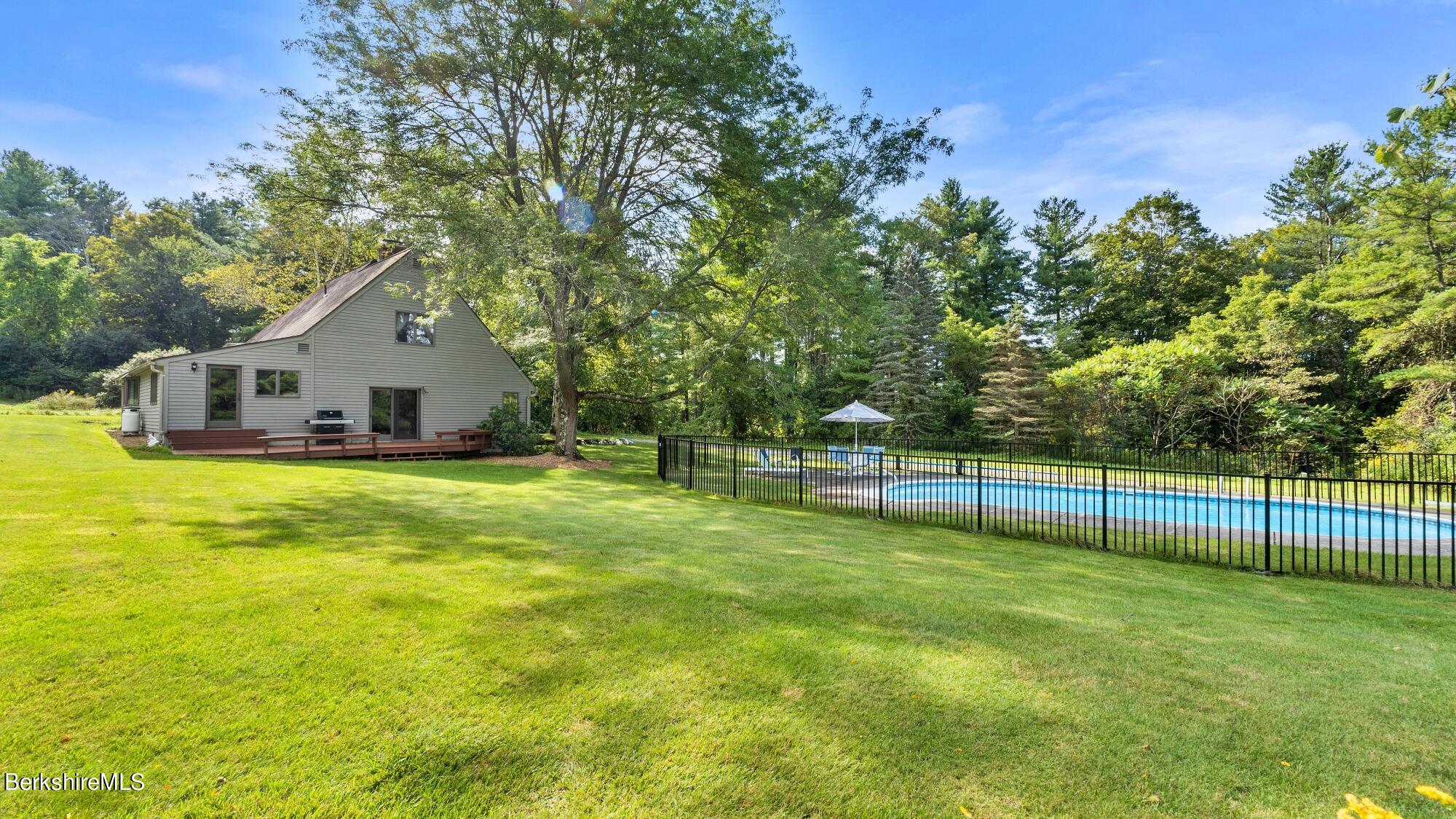 16 Interlaken Road Stockbridge, MA 01266 - Photo 41 of 42 a view of a house with swimming pool and a big yard