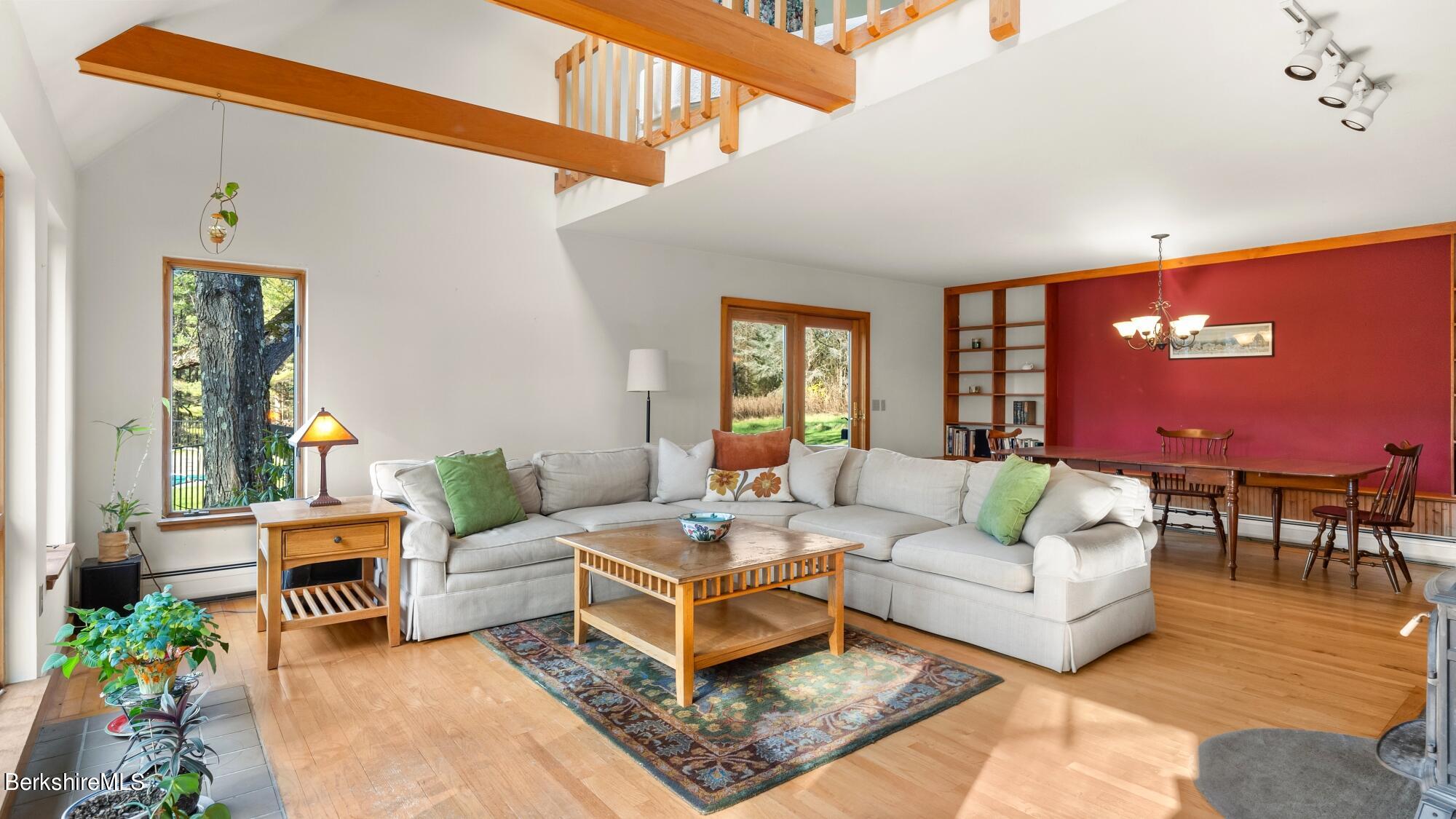 16 Interlaken Road Stockbridge, MA 01266 - Photo 7 of 42 a living room with furniture a rug and a potted plant