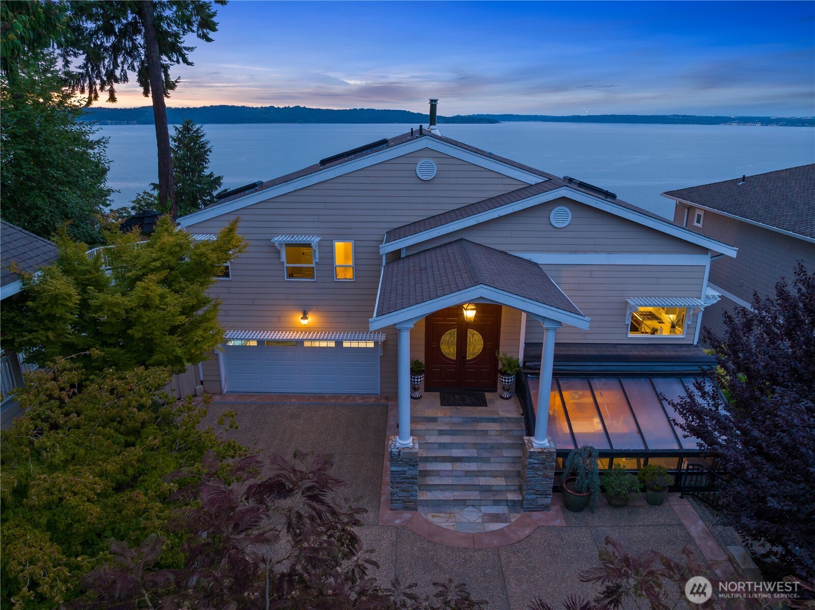 a view of a brick house with a yard