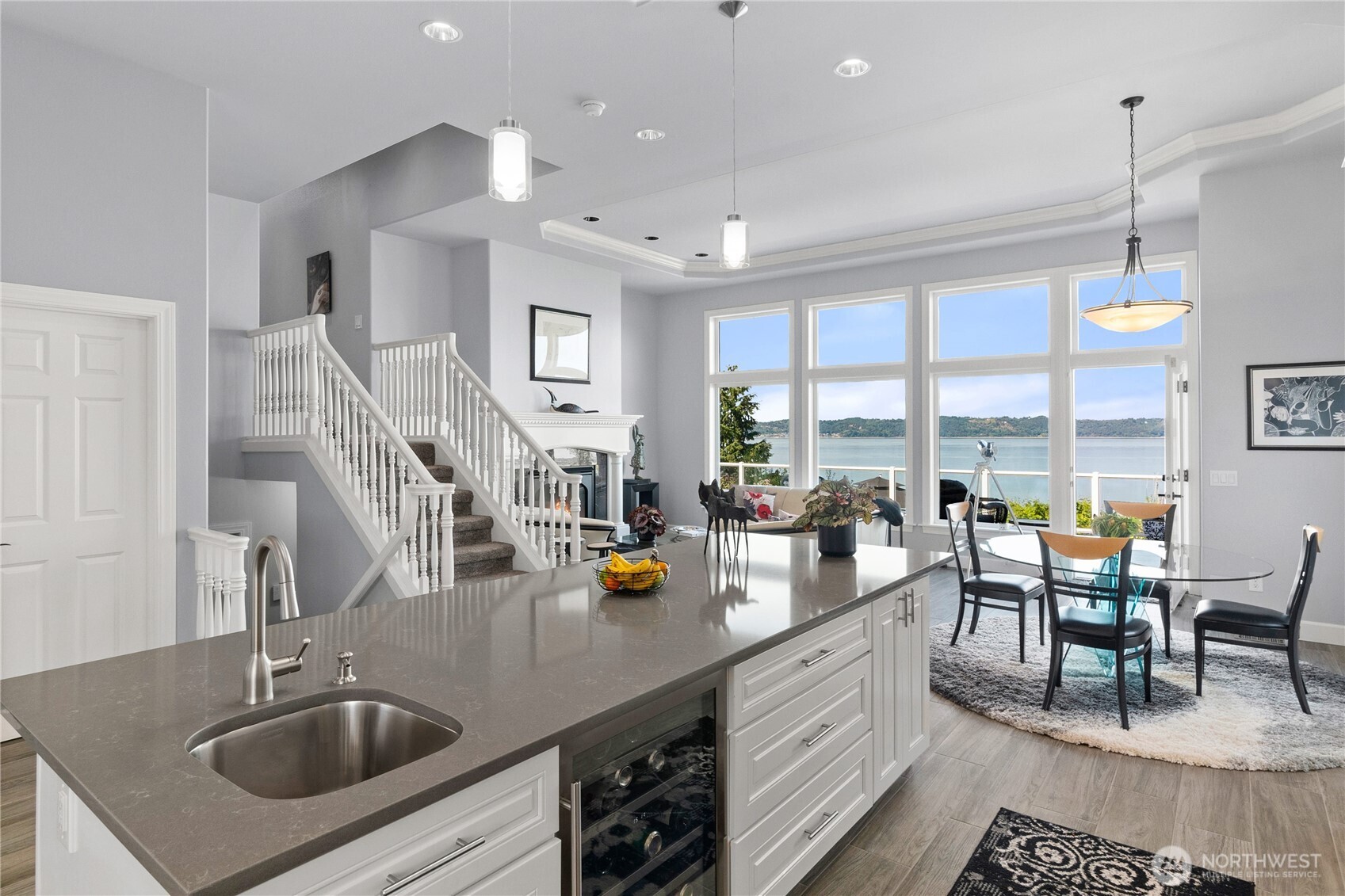 4346 Southwest 307th Street Federal Way, WA 98023 - Photo 11 of 40 a kitchen with a sink a counter and chairs