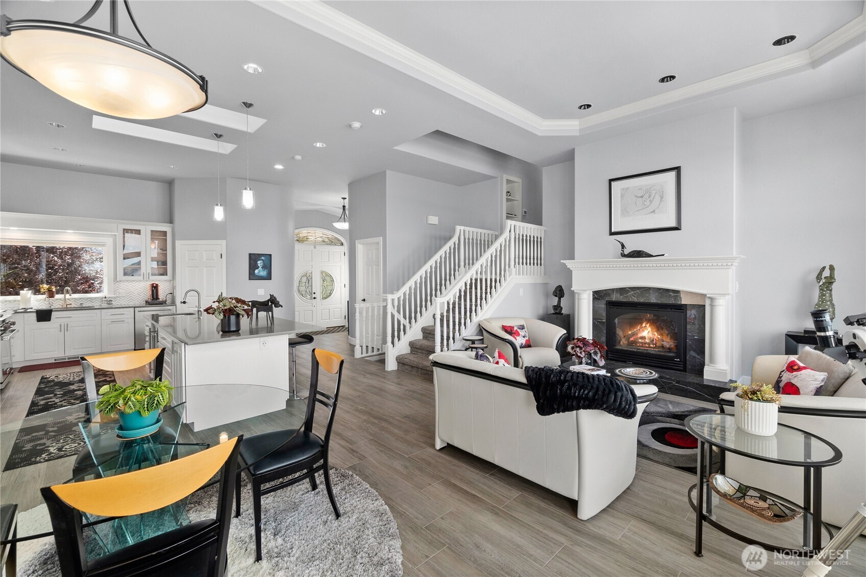 4346 Southwest 307th Street Federal Way, WA 98023 - Photo 12 of 40 a living room with furniture a fireplace and kitchen view