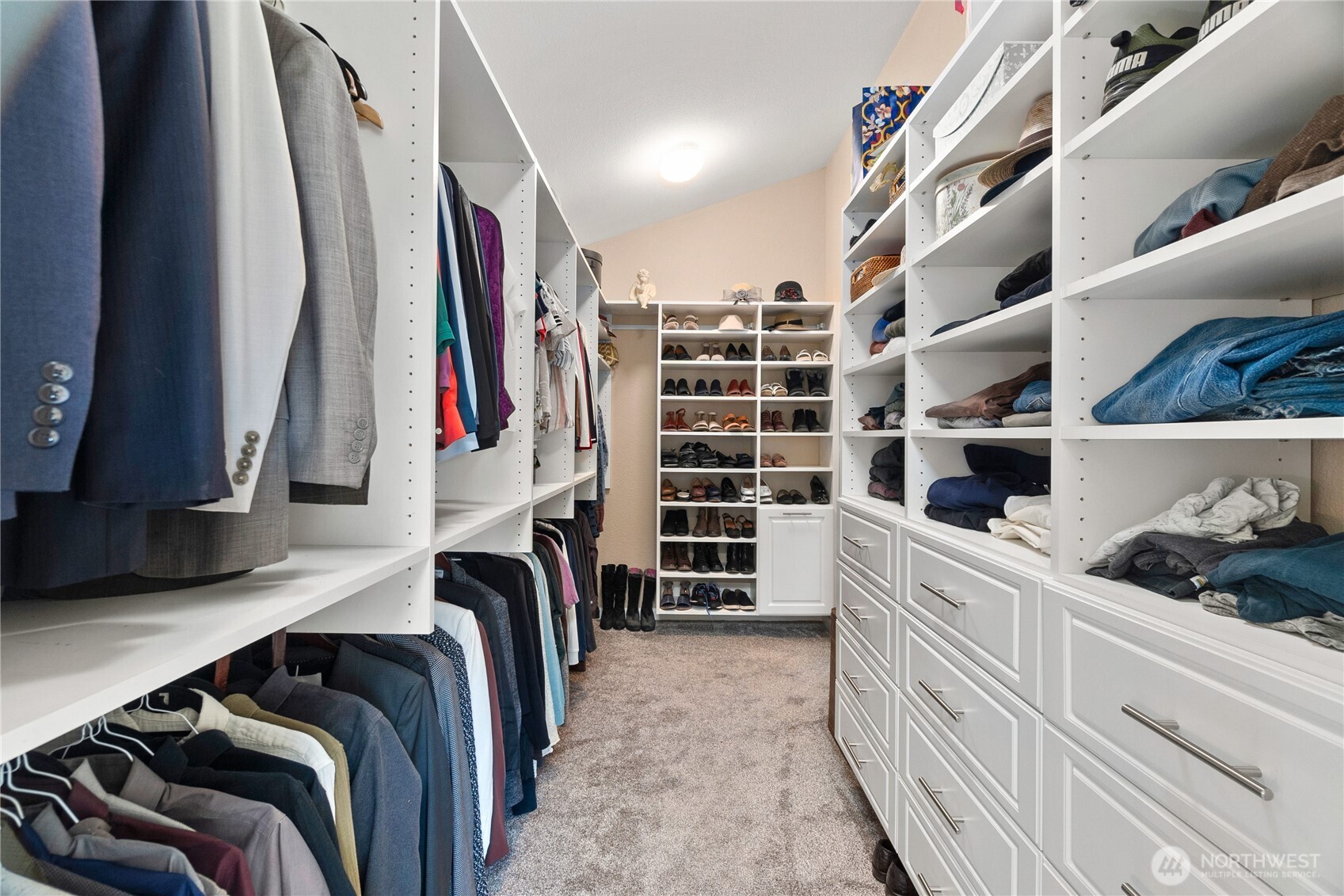 4346 Southwest 307th Street Federal Way, WA 98023 - Photo 18 of 40 a view of walk in closet with clothes and shoes