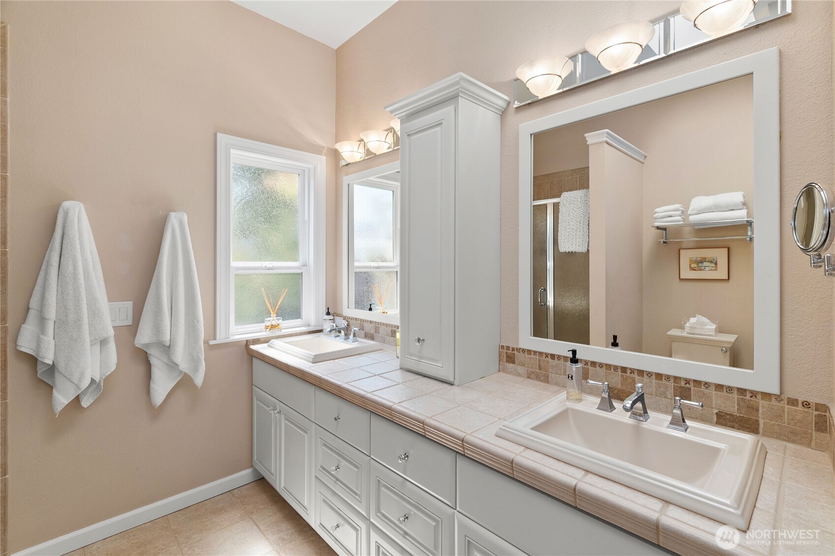 4346 Southwest 307th Street Federal Way, WA 98023 - Photo 19 of 40 a bathroom with double vanity sink and a mirror