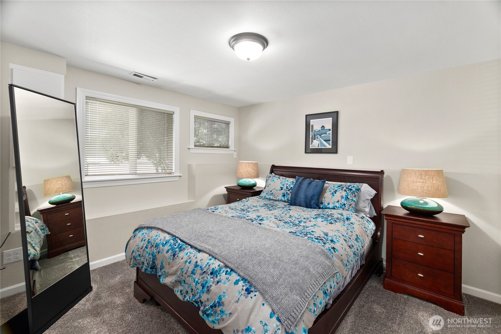 4346 Southwest 307th Street Federal Way, WA 98023 - Photo 21 of 40 a bedroom with a bed and a lamp on dresser