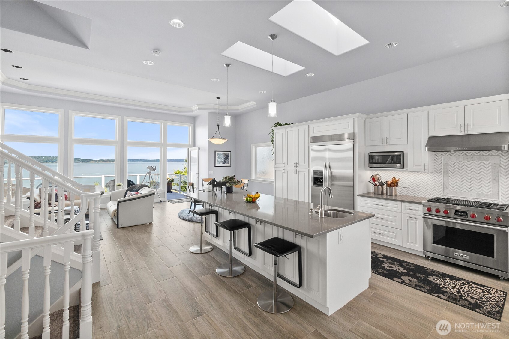 4346 Southwest 307th Street Federal Way, WA 98023 - Photo 8 of 40 a large white kitchen with stainless steel appliances