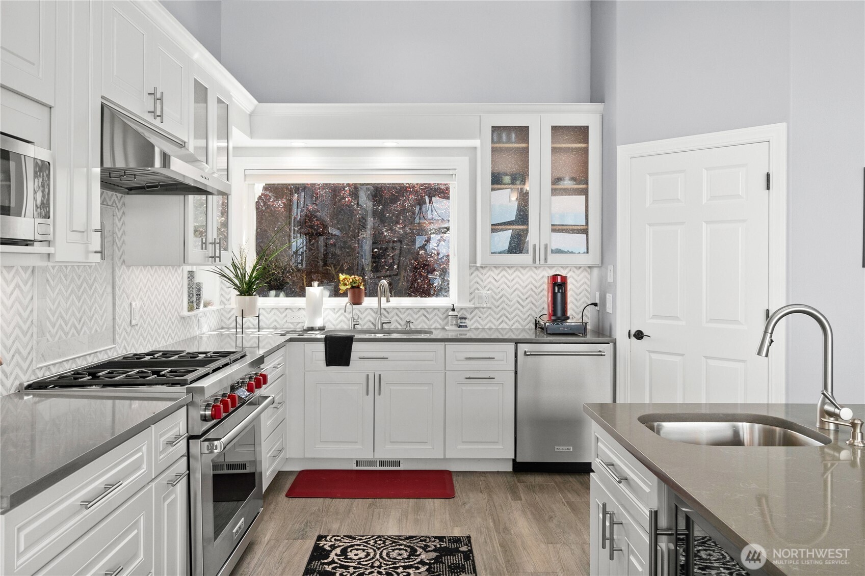 4346 Southwest 307th Street Federal Way, WA 98023 - Photo 10 of 40 a kitchen with a sink stove and cabinets