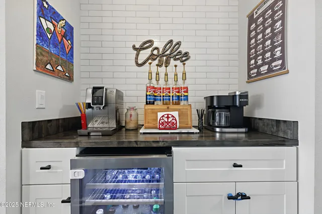 a kitchen with a counter space a sink and cabinets