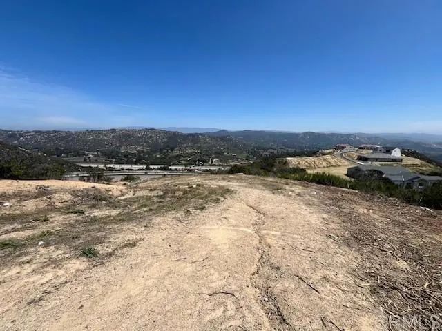 a view of a town with mountains in the background