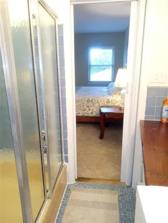 a view of bedroom and bathroom