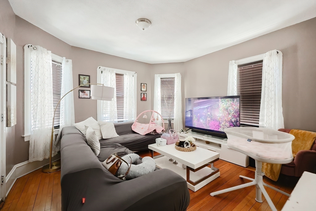 105 16th Street Fall River, MA 02723 - Photo 16 of 31 a living room with furniture and a large window