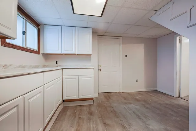 a view of cabinets and wooden floor