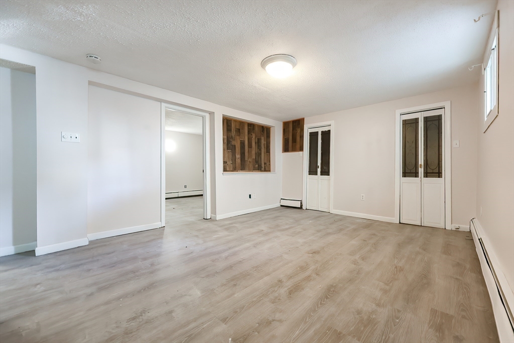 105 16th Street Fall River, MA 02723 - Photo 22 of 31 a view of empty room with wooden floor