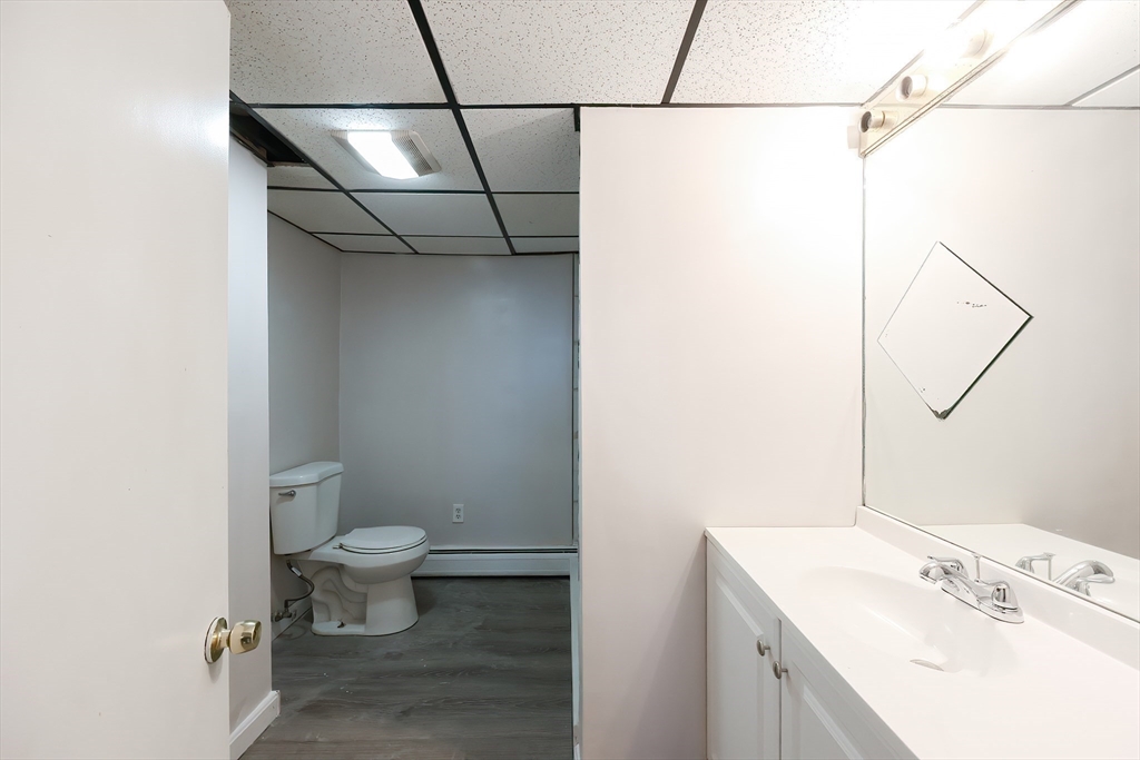 105 16th Street Fall River, MA 02723 - Photo 25 of 31 a bathroom with a sink a toilet and shower