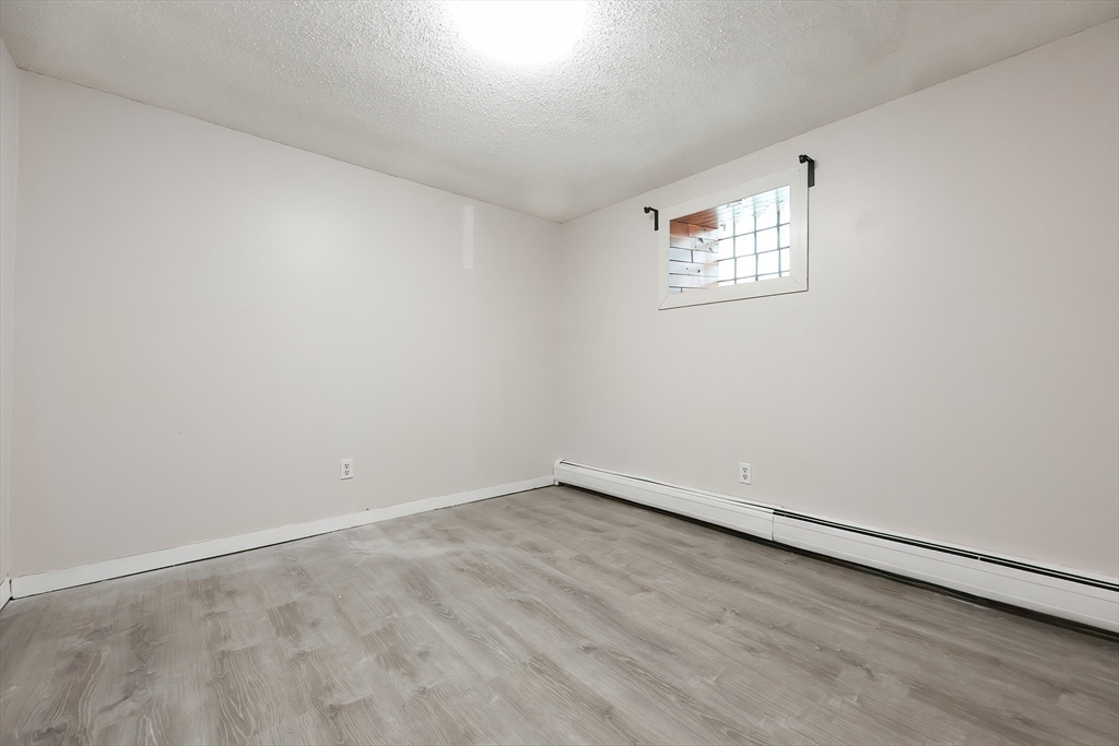 105 16th Street Fall River, MA 02723 - Photo 29 of 31 an empty room with a workspace