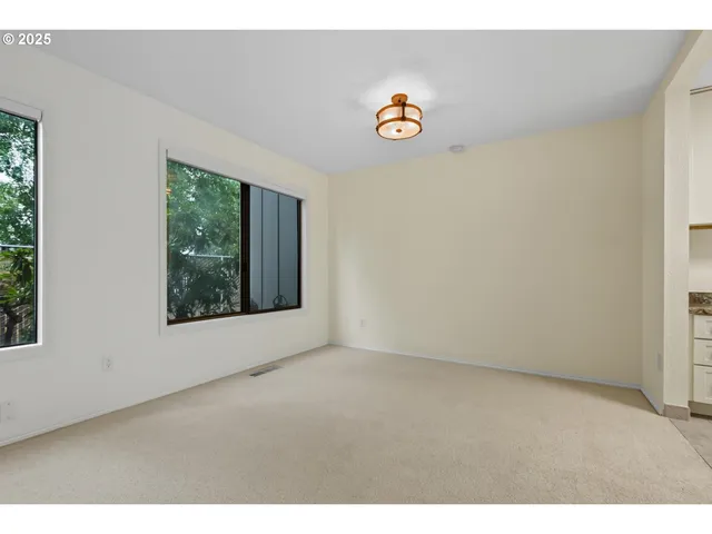 a kitchen with stainless steel appliances granite countertop a refrigerator and cabinets
