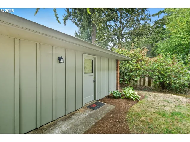 a view of an empty room with a garage