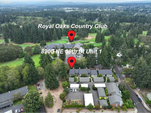 an outdoor space with lots of trees and flowers