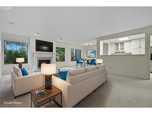 a view of empty room with a fireplace