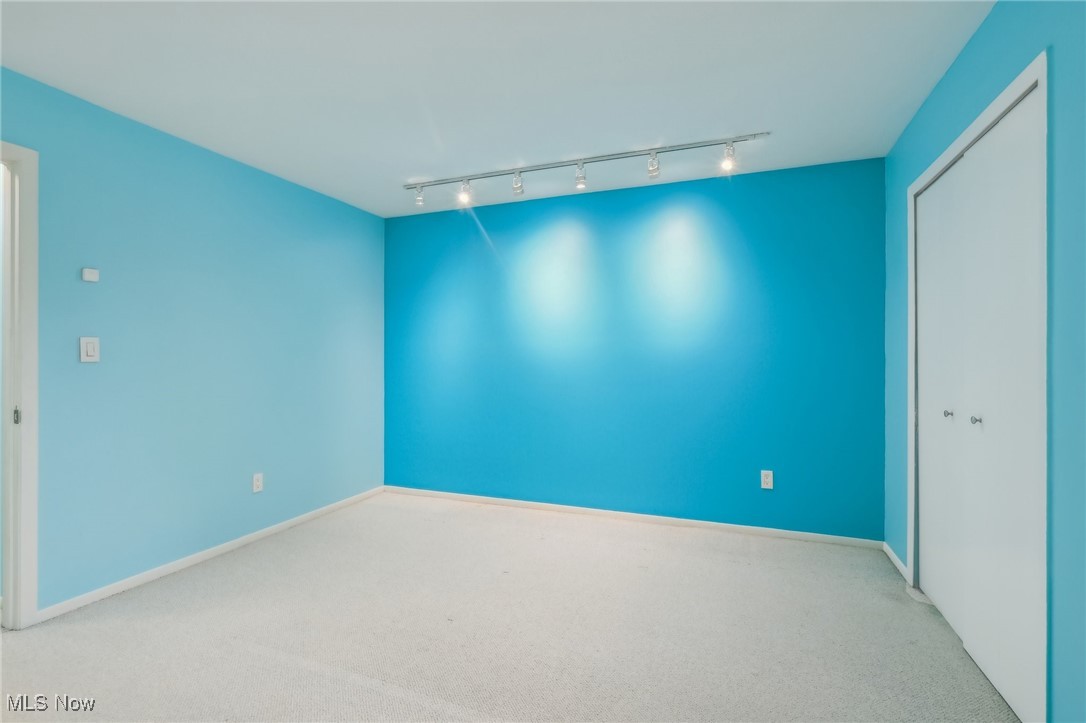 3484 Mayfield Road, Unit 3426 Cleveland Heights, OH 44118 - Photo 19 of 33 Carpeted spare room with baseboards