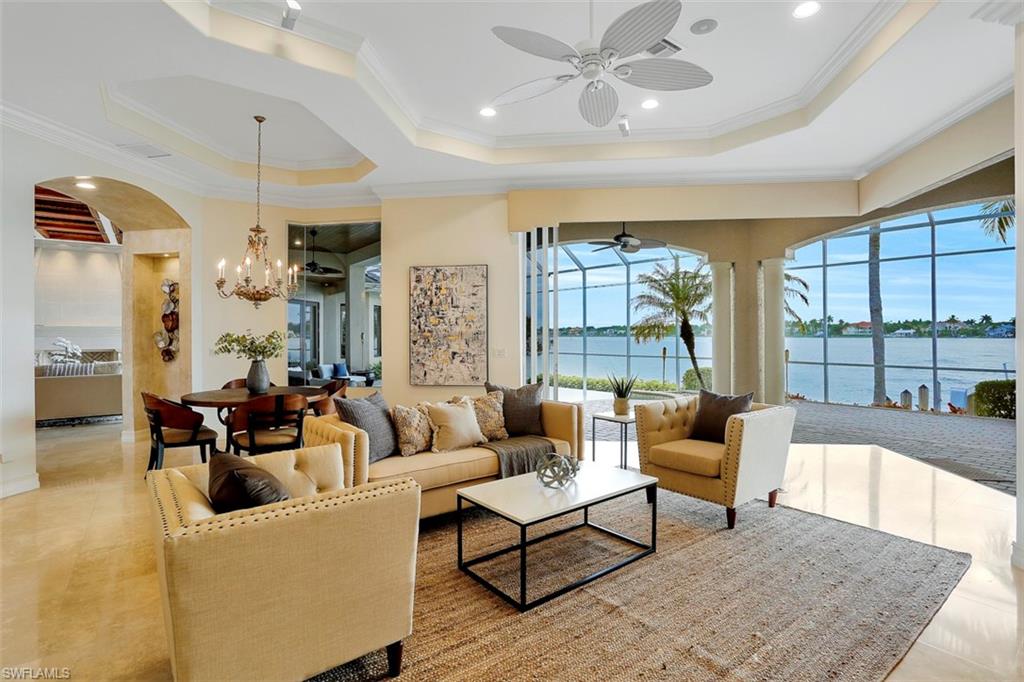 2050 Kingfish Road Naples, FL 34102 - Photo 14 of 35 a living room with furniture and a large window