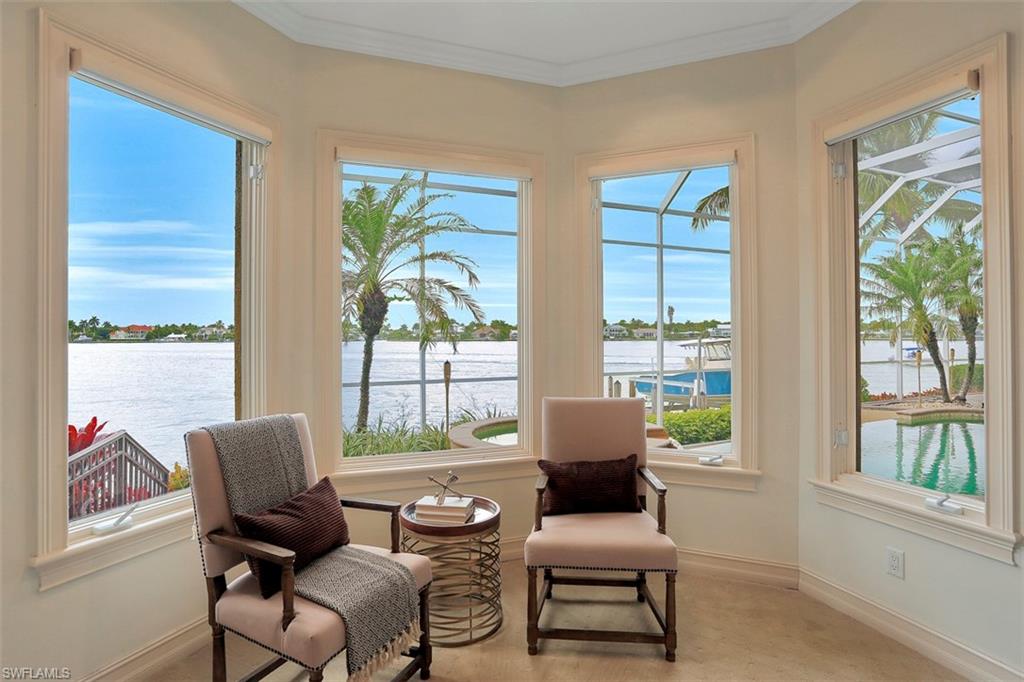 2050 Kingfish Road Naples, FL 34102 - Photo 24 of 35 a living room with furniture and a window