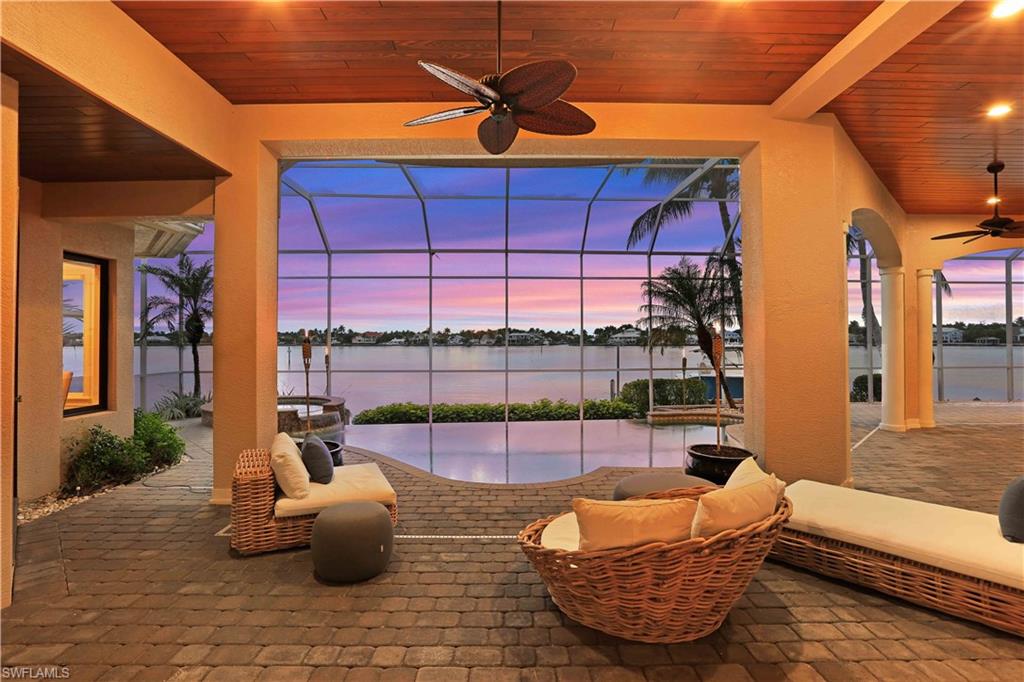 2050 Kingfish Road Naples, FL 34102 - Photo 4 of 35 a building outdoor space with patio furniture