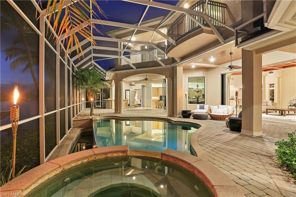 2050 Kingfish Road Naples, FL 34102 - Photo 5 of 35 a view of a living room with a large window