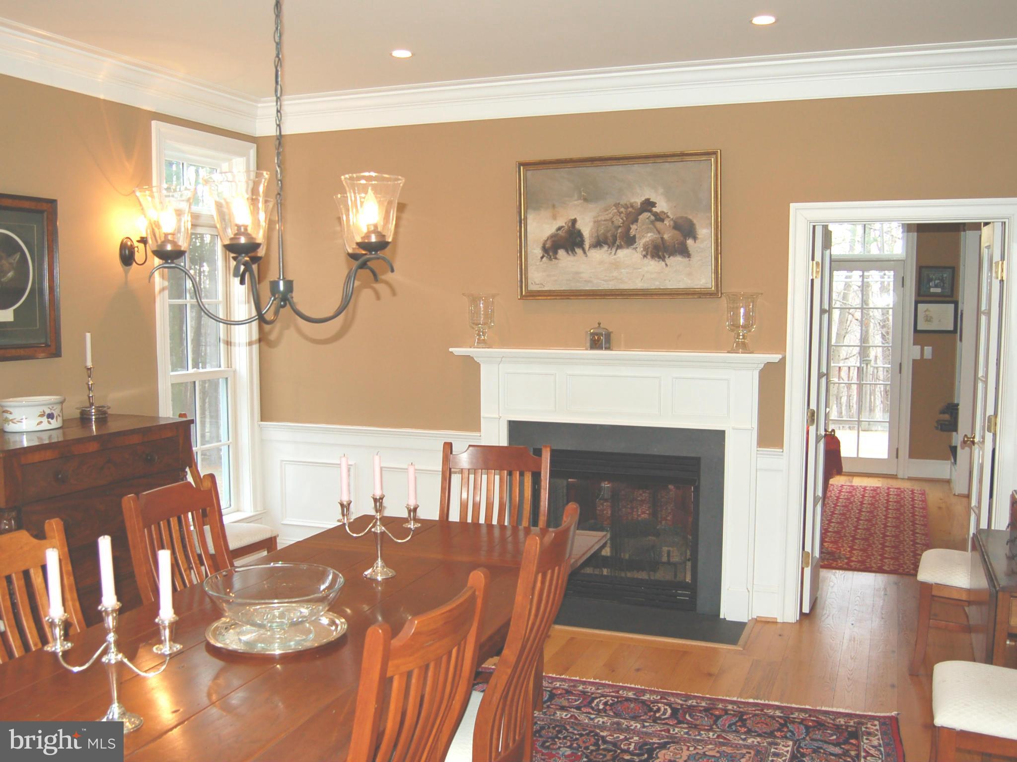 2312 Monkton Road Monkton, MD 21111 - Photo 15 of 30 a living room with furniture a flat screen tv and a fireplace