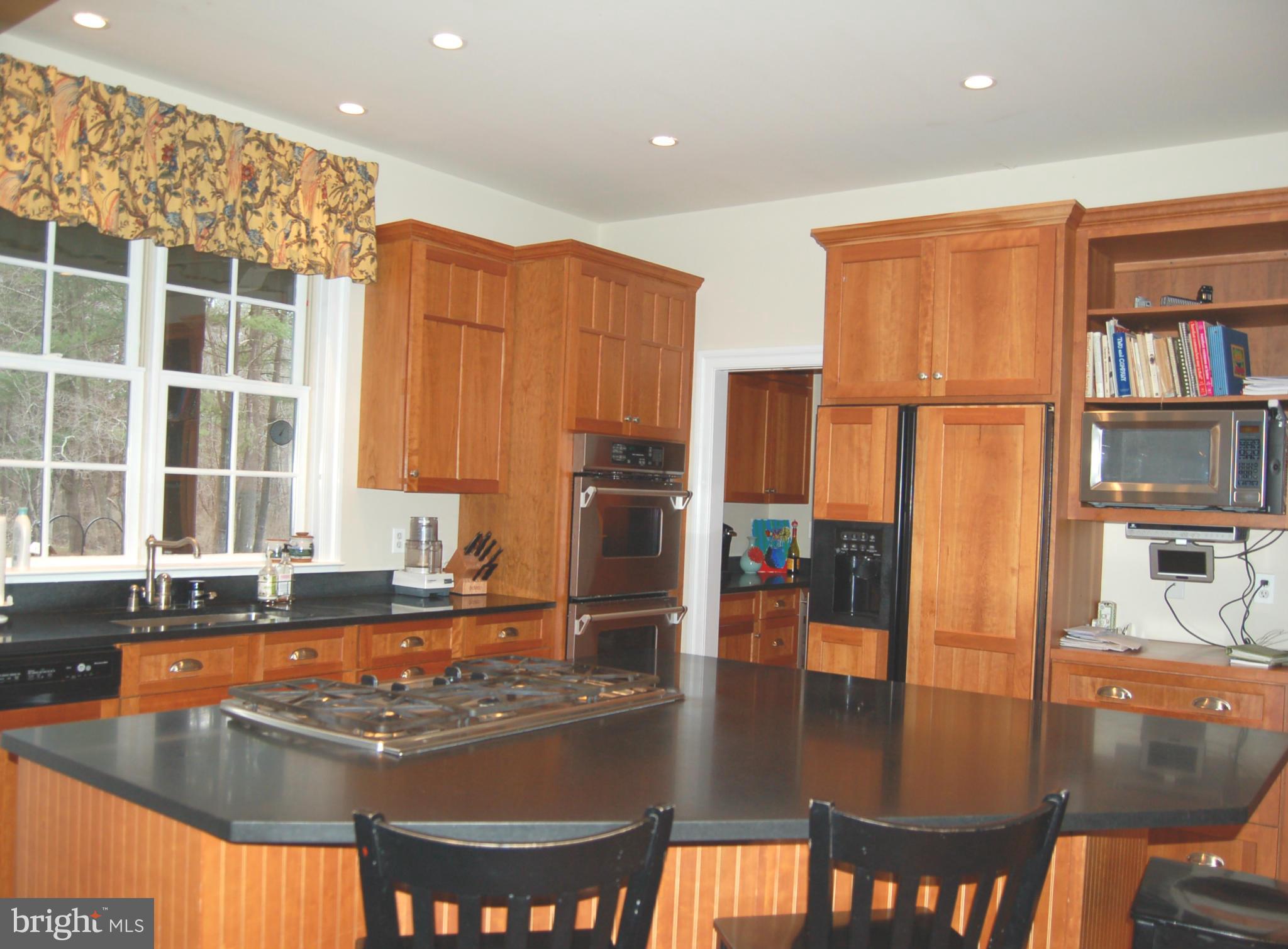2312 Monkton Road Monkton, MD 21111 - Photo 7 of 30 a kitchen with stainless steel appliances granite countertop a sink and a refrigerator