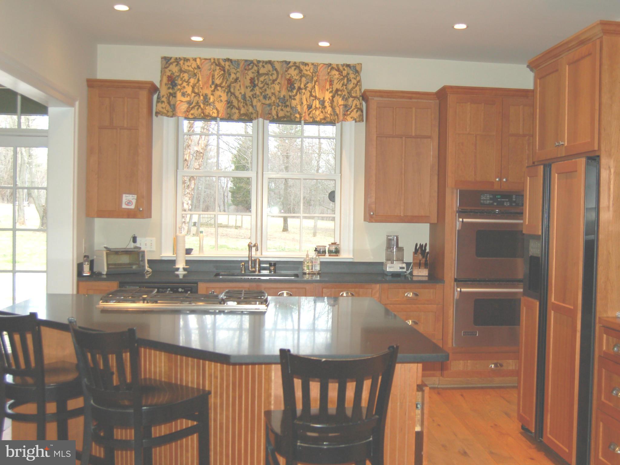 2312 Monkton Road Monkton, MD 21111 - Photo 8 of 30 a kitchen with granite countertop a stove and a large window