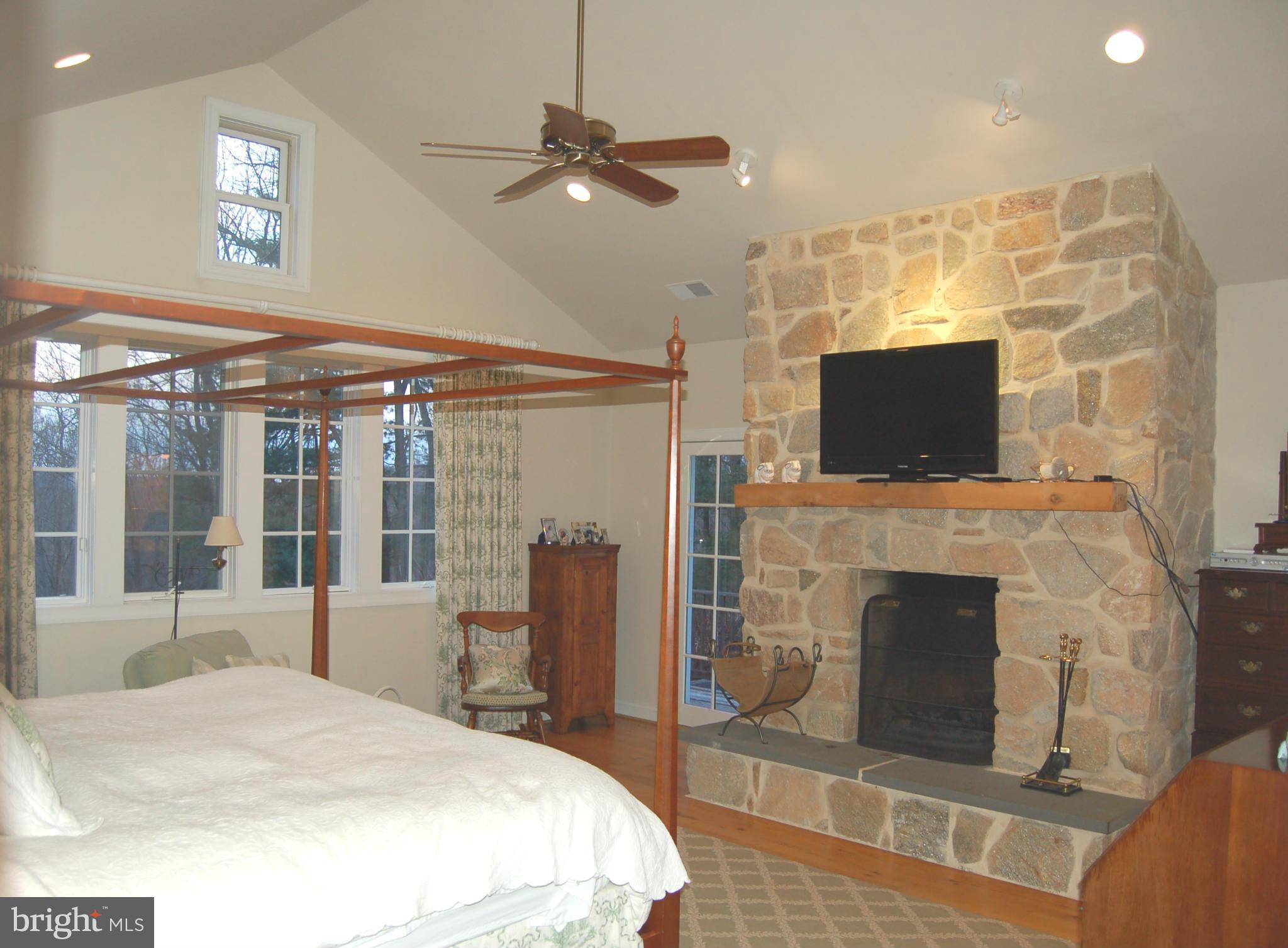2312 Monkton Road Monkton, MD 21111 - Photo 10 of 30 a bedroom with a bed and a fireplace