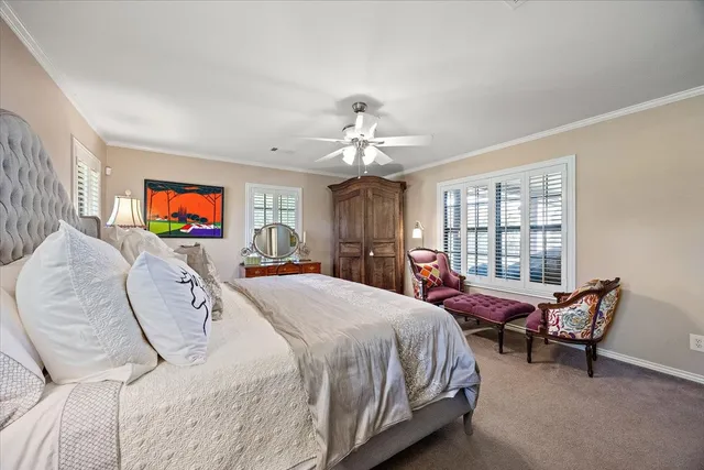 a bed room with a bed and a chair